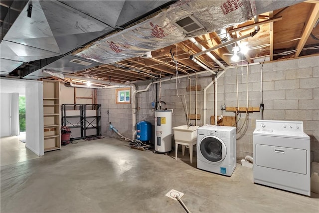 1860 Washington Rd, Washington Twp Wml, PA 15613 - below grade area with washing machine and clothes dryer, water heater, and a water pressure tank