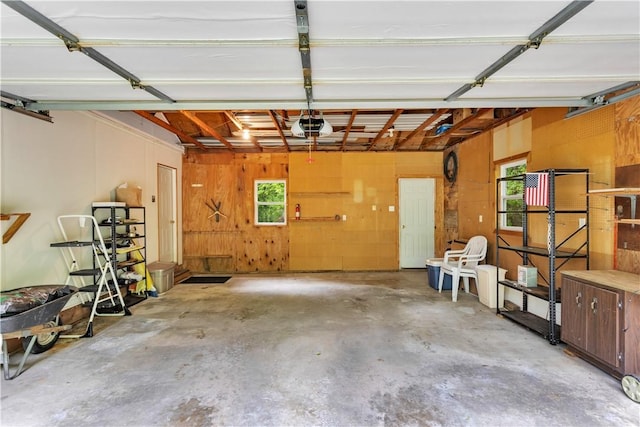 1860 Washington Rd, Washington Twp Wml, PA 15613 - garage with a garage door opener and wooden walls