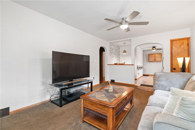 3261 Central Ave, Brighton Heights, PA 15212 - living area with arched walkways, ceiling fan, carpet floors, and baseboards