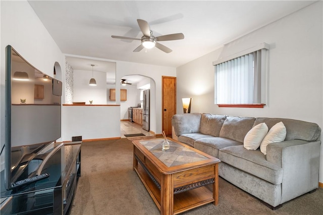 3261 Central Ave, Brighton Heights, PA 15212 - living room with a ceiling fan, arched walkways, light colored carpet, and baseboards