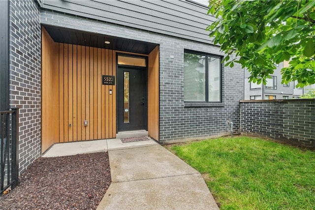 5523 Butler St, Lawrenceville, PA 15201 - property entrance featuring brick siding and a yard