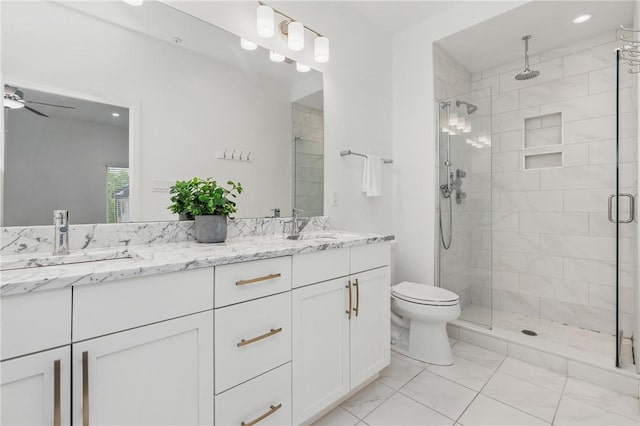 5523 Butler St, Lawrenceville, PA 15201 - bathroom featuring marble look tiles, double vanity, a stall shower, toilet, and a ceiling fan
