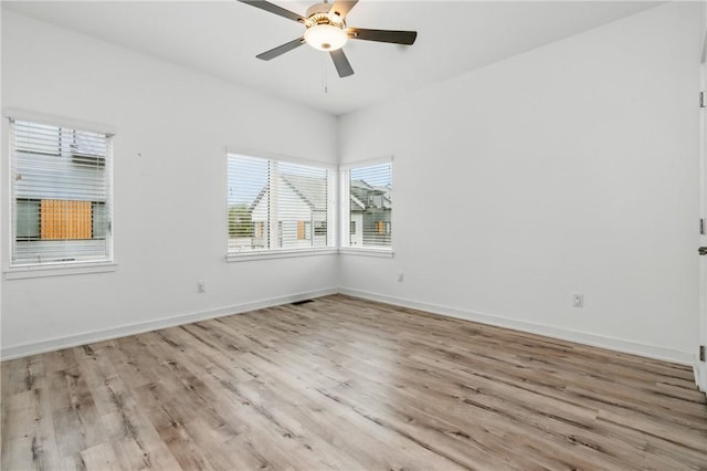 5523 Butler St, Lawrenceville, PA 15201 - empty room with wood finished floors, baseboards, and a ceiling fan