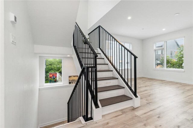 5523 Butler St, Lawrenceville, PA 15201 - staircase featuring plenty of natural light, wood finished floors, baseboards, and recessed lighting