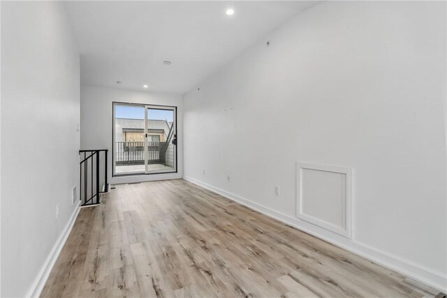 5523 Butler St, Lawrenceville, PA 15201 - empty room featuring wood finished floors, recessed lighting, and baseboards