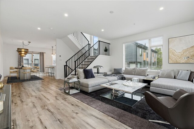 5523 Butler St, Lawrenceville, PA 15201 - living room with wood finished floors, plenty of natural light, stairs, recessed lighting, and baseboards