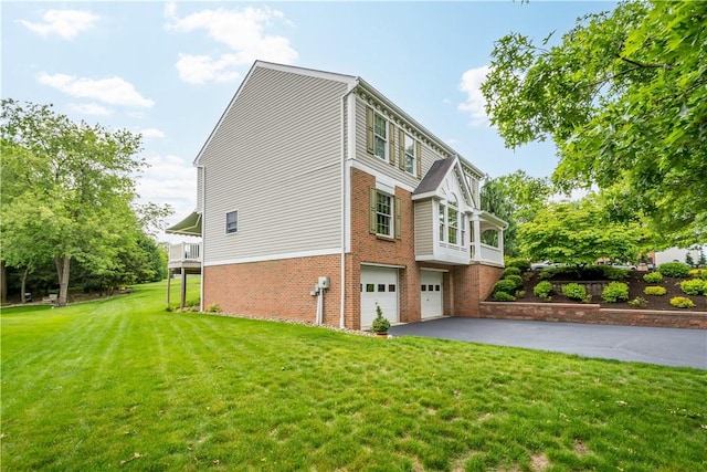5743 Villahaven Dr, Bethel Park, PA 15236 - view of property exterior with brick siding, a garage, asphalt driveway, and a lawn