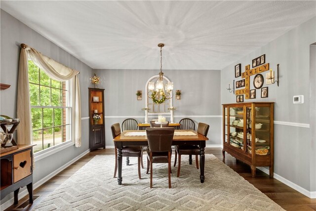 5743 Villahaven Dr, Bethel Park, PA 15236 - dining space featuring a chandelier, wood finished floors, and baseboards