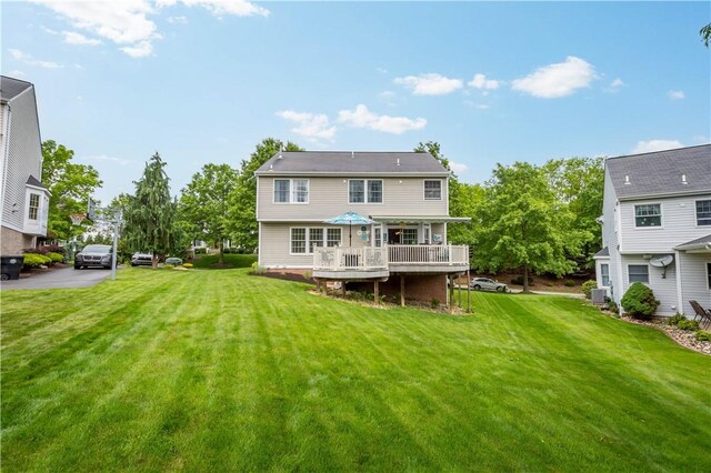 5743 Villahaven Dr, Bethel Park, PA 15236 - rear view of house with a wooden deck, a yard, and central AC