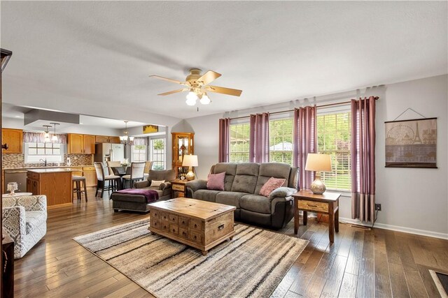 5743 Villahaven Dr, Bethel Park, PA 15236 - living area featuring ceiling fan, dark wood-style flooring, and baseboards