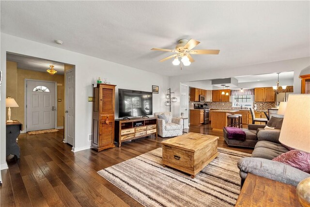 5743 Villahaven Dr, Bethel Park, PA 15236 - living area featuring ceiling fan, dark wood-type flooring, and baseboards
