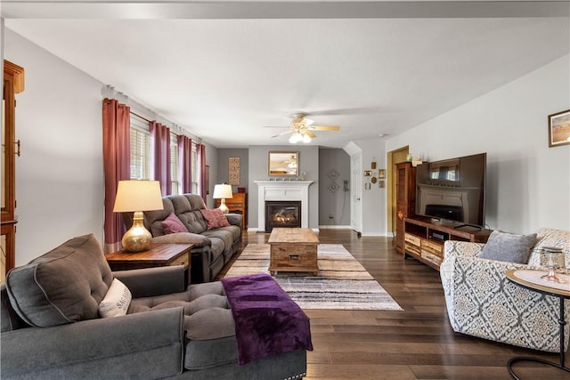 5743 Villahaven Dr, Bethel Park, PA 15236 - living room featuring a ceiling fan, a glass covered fireplace, dark wood-style floors, and baseboards
