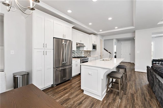 2008 Ashton Row, South Fayette, PA 15017 - kitchen with premium appliances, a sink, under cabinet range hood, dark wood finished floors, and recessed lighting