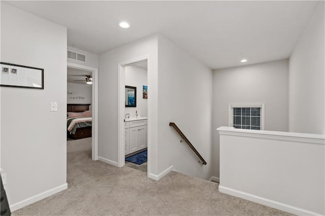 2008 Ashton Row, South Fayette, PA 15017 - hall with an upstairs landing, light carpet, recessed lighting, baseboards, and a sink