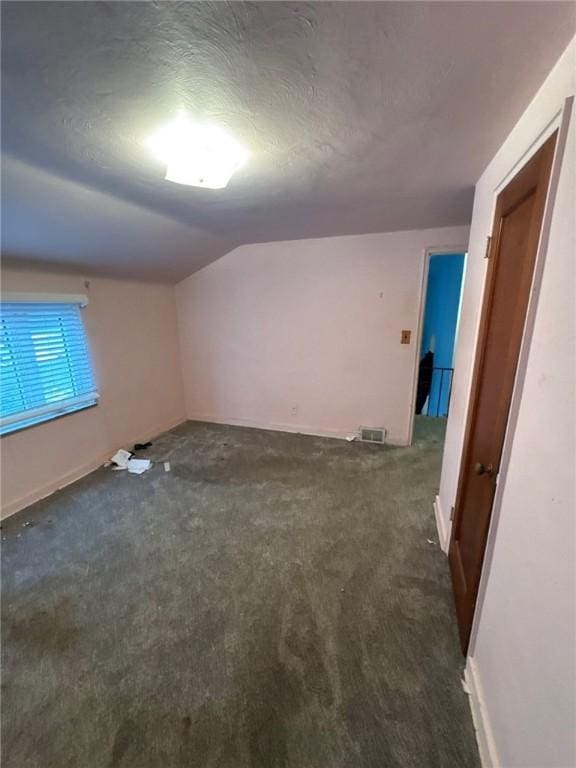 188 Chickasaw Ave, Mccandless, PA 15237 - spare room featuring vaulted ceiling and dark colored carpet