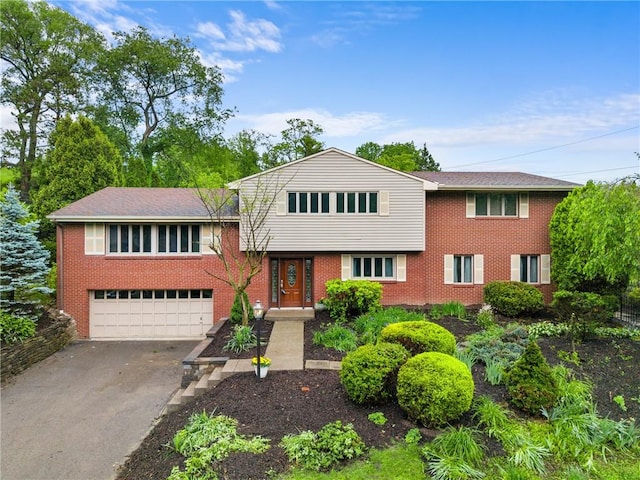 2525 Chapelwood Dr, Upper St Clair, PA 15241 - tri-level home with driveway, a garage, and brick siding