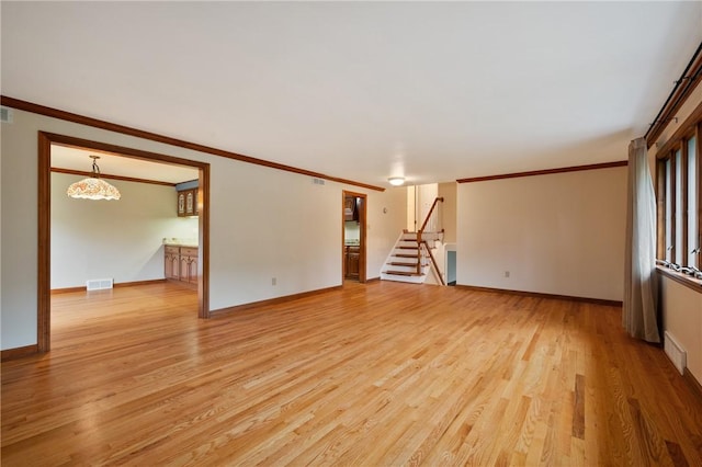 2525 Chapelwood Dr, Upper St Clair, PA 15241 - unfurnished living room with light wood-style floors, baseboards, stairs, and ornamental molding