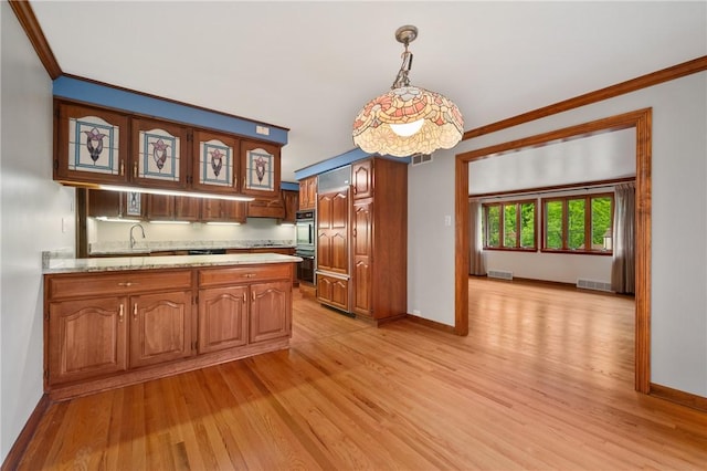 2525 Chapelwood Dr, Upper St Clair, PA 15241 - kitchen featuring light countertops, a peninsula, light wood-style floors, ornamental molding, and baseboards