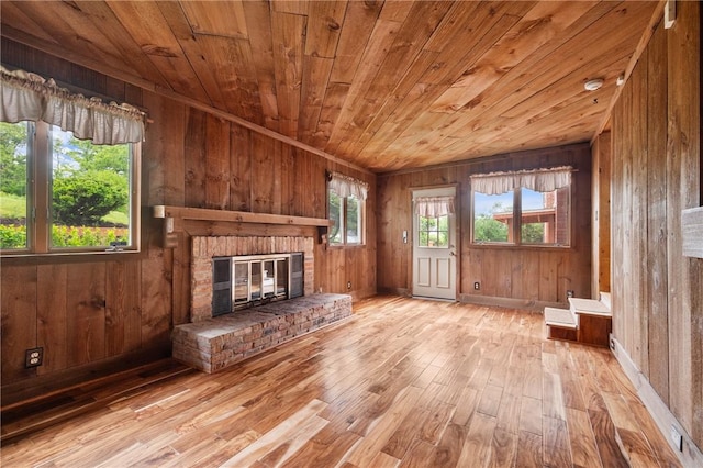 2525 Chapelwood Dr, Upper St Clair, PA 15241 - unfurnished living room featuring wood ceiling, wood walls, a fireplace, and wood-type flooring