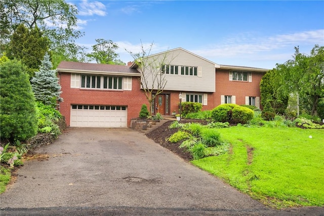 2525 Chapelwood Dr, Upper St Clair, PA 15241 - tri-level home with driveway, a garage, brick siding, and a front yard