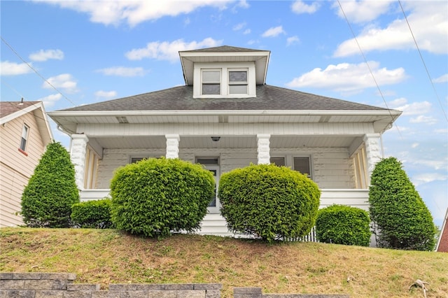 1222 Forest Ave, New Kensington, PA 15068 - view of side of property featuring a porch, roof with shingles, and a lawn
