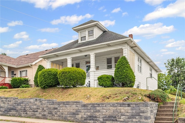 1222 Forest Ave, New Kensington, PA 15068 - view of front of home featuring stairway, a chimney, a porch, and a front lawn