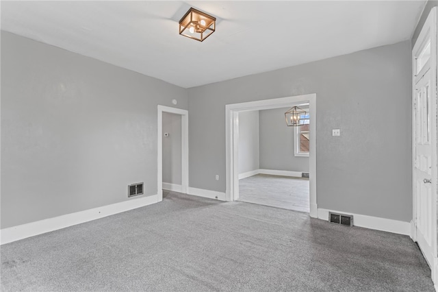 1222 Forest Ave, New Kensington, PA 15068 - unfurnished room with a chandelier, baseboards, and carpet flooring