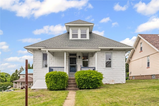1222 Forest Ave, New Kensington, PA 15068 - bungalow with a porch, roof with shingles, and a front lawn