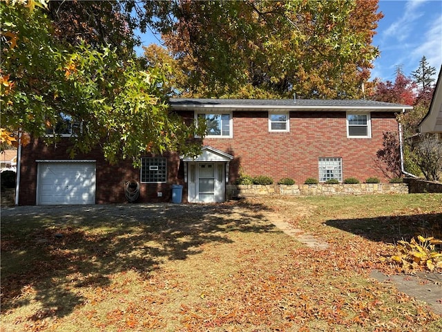 1877 Main St, Arona, PA 15617 - rear view of house featuring brick siding and a garage
