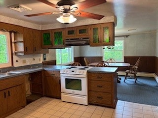 1877 Main St, Arona, PA 15617 - kitchen featuring electric range, under cabinet range hood, brown cabinetry, open shelves, and dark countertops