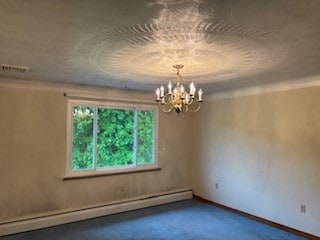 1877 Main St, Arona, PA 15617 - empty room featuring a baseboard radiator and a chandelier