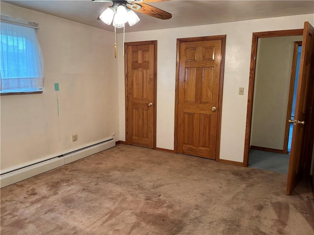 1877 Main St, Arona, PA 15617 - unfurnished bedroom featuring a baseboard radiator, carpet flooring, baseboards, and ceiling fan