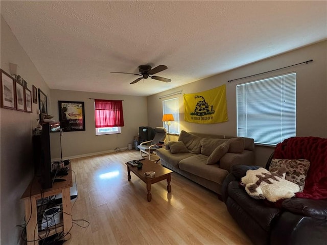 1022-1024 S Trenton Ave, Regent Square, PA 15221 - living room featuring a textured ceiling, light wood-type flooring, ceiling fan, and baseboards