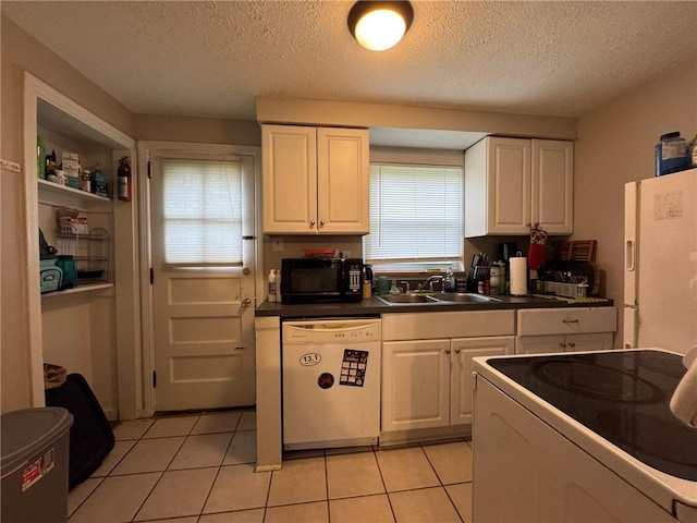 1022-1024 S Trenton Ave, Regent Square, PA 15221 - kitchen with white appliances, a sink, white cabinetry, dark countertops, and light tile patterned floors