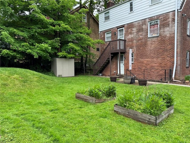 1022-1024 S Trenton Ave, Regent Square, PA 15221 - back of property with a garden, a lawn, a chimney, and brick siding