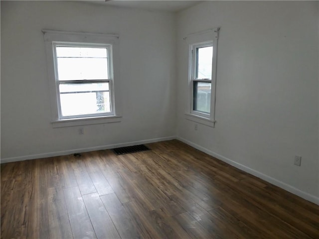 1112 Wade St, Aliquippa, PA 15001 - unfurnished room with plenty of natural light, dark wood-style floors, and baseboards