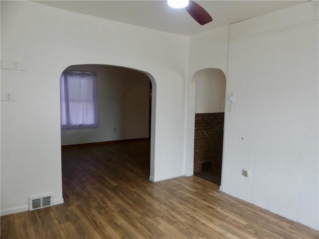 1112 Wade St, Aliquippa, PA 15001 - unfurnished room with a ceiling fan, wood finished floors, and arched walkways