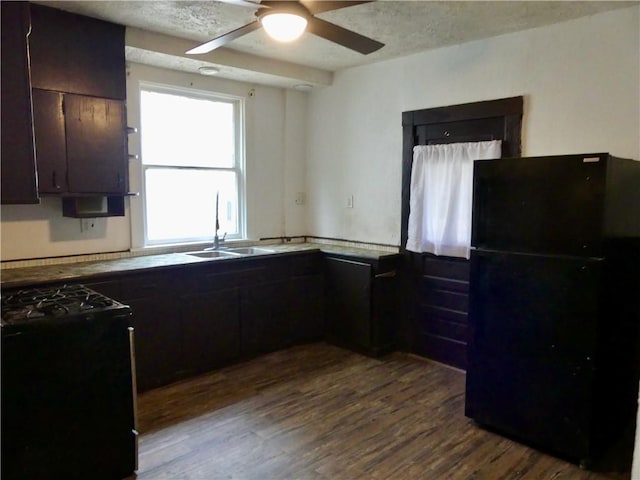 1112 Wade St, Aliquippa, PA 15001 - kitchen featuring black appliances, a sink, dark wood finished floors, ceiling fan, and dark brown cabinetry