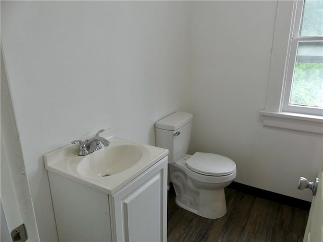 1112 Wade St, Aliquippa, PA 15001 - bathroom with toilet, vanity, wood finished floors, and baseboards