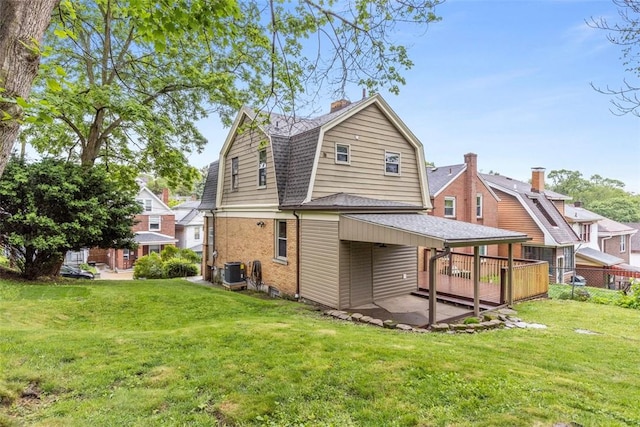 44 Pasadena St, Mt Washington, PA 15211 - back of property with a gambrel roof, cooling unit, a shingled roof, a patio area, and a chimney