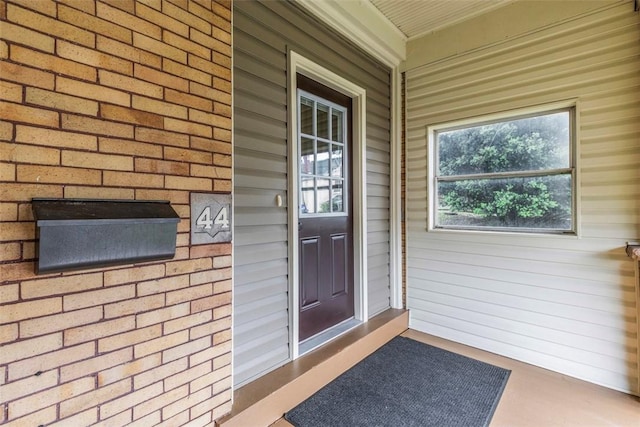 44 Pasadena St, Mt Washington, PA 15211 - doorway to property featuring brick siding and a porch
