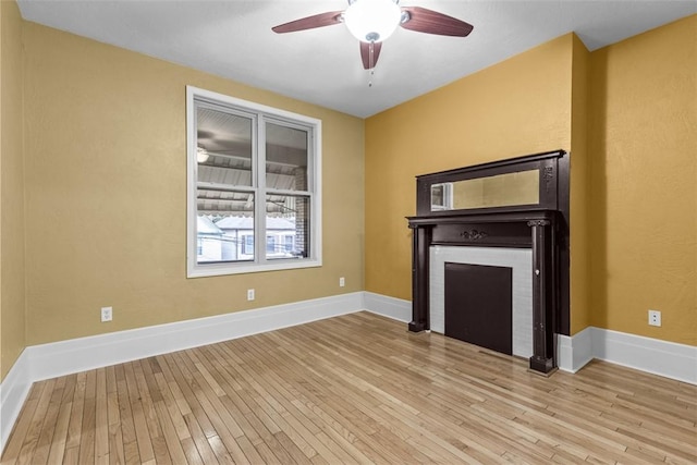44 Pasadena St, Mt Washington, PA 15211 - unfurnished living room featuring wood-type flooring, ceiling fan, baseboards, and a fireplace