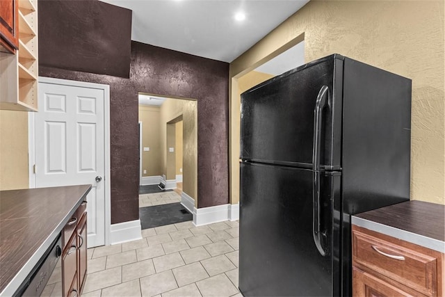44 Pasadena St, Mt Washington, PA 15211 - kitchen featuring freestanding refrigerator, a textured wall, light tile patterned floors, dark countertops, and baseboards