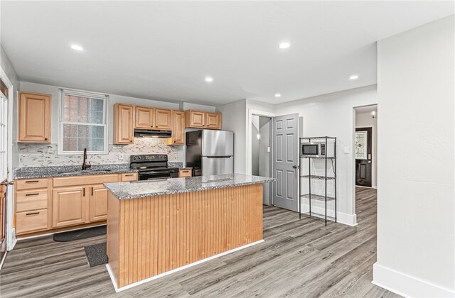 534 Overbrook Blvd, Overbrook, PA 15210 - kitchen featuring appliances with stainless steel finishes, a sink, a center island, light brown cabinetry, and under cabinet range hood