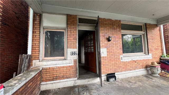 222 Luray St, Perry Hilltop, PA 15214 - doorway to property with brick siding and covered porch