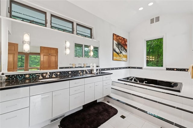 428 Jefferson School Rd, Cook Twp, PA 15658 - bathroom with double vanity, vaulted ceiling, plenty of natural light, a garden tub, and recessed lighting