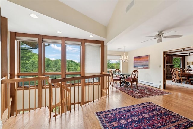 428 Jefferson School Rd, Cook Twp, PA 15658 - hallway with a baseboard heating unit, a chandelier, wood finished floors, vaulted ceiling, and recessed lighting