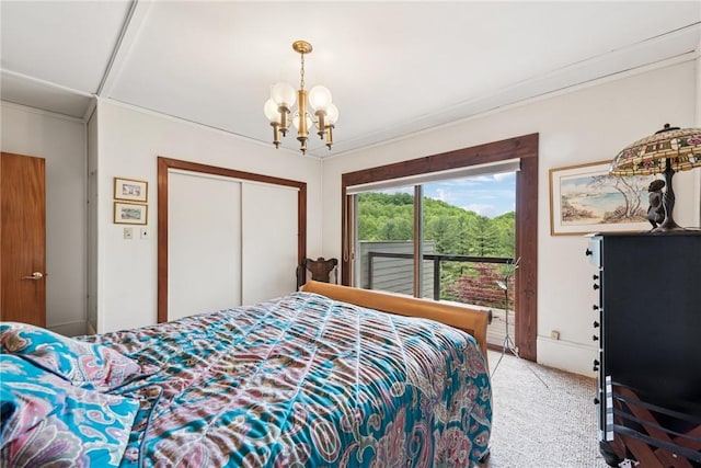 428 Jefferson School Rd, Cook Twp, PA 15658 - bedroom with a chandelier, light carpet, a closet, and access to outside