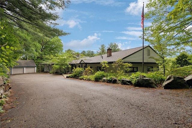 428 Jefferson School Rd, Cook Twp, PA 15658 - view of front of home with a garage, a chimney, and an outdoor structure