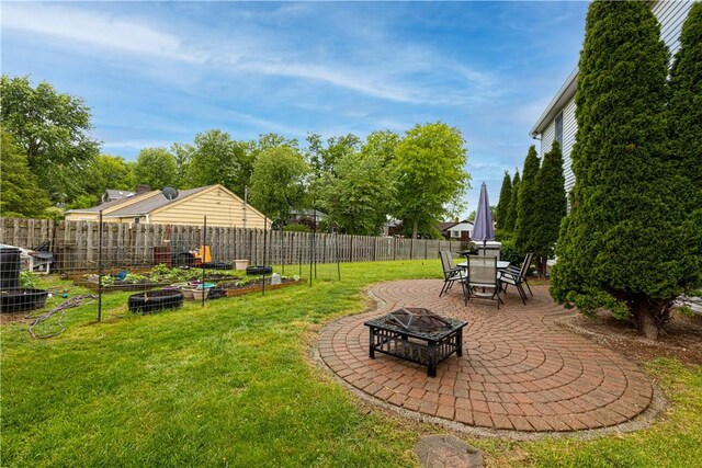 704 Park Ave, Rostraver, PA 15012 - view of yard with an outdoor fire pit, a garden, and a patio area